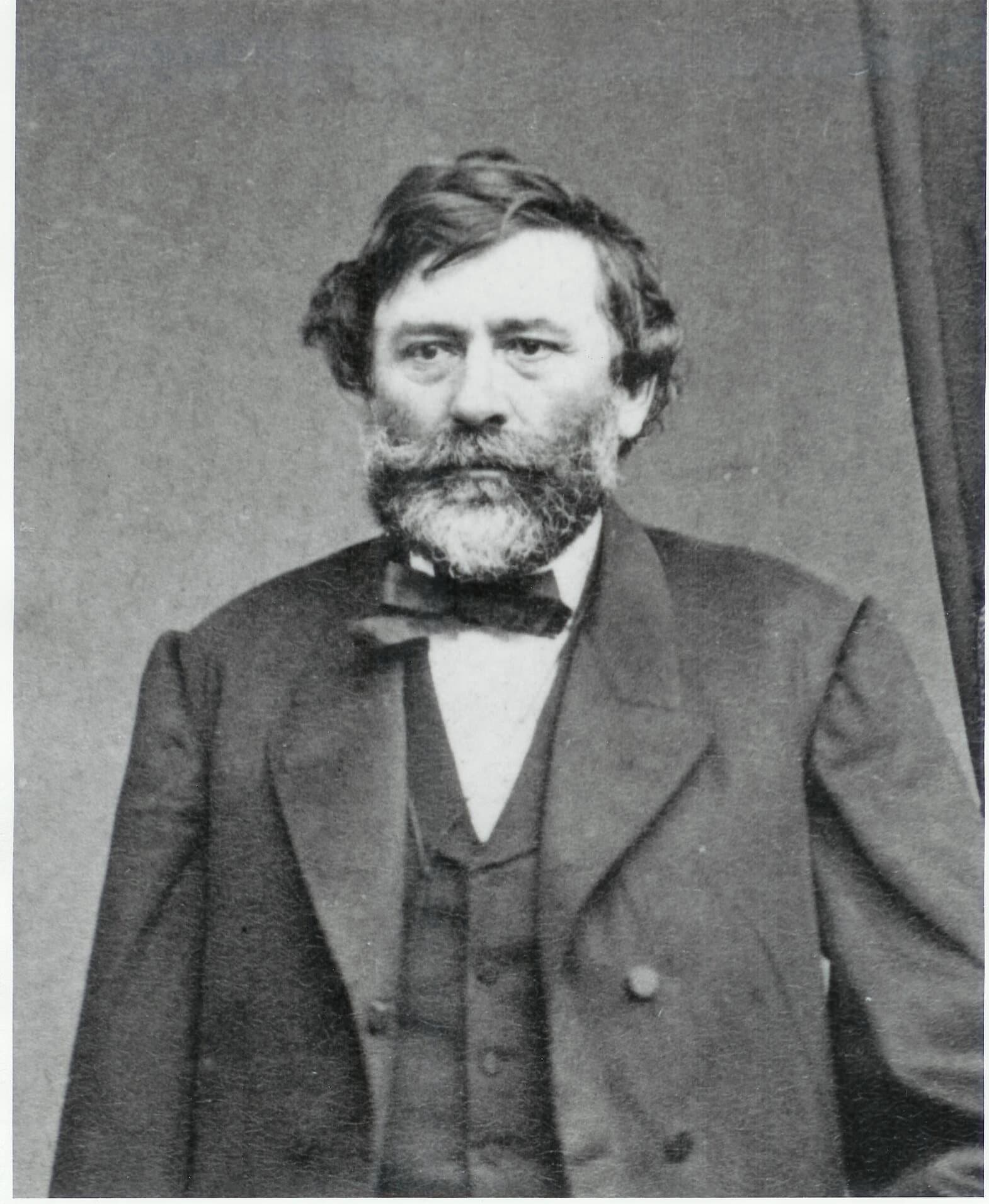 Studio portrait of Agoston Haraszthy, bearded, in a dark frock coat and bow tie