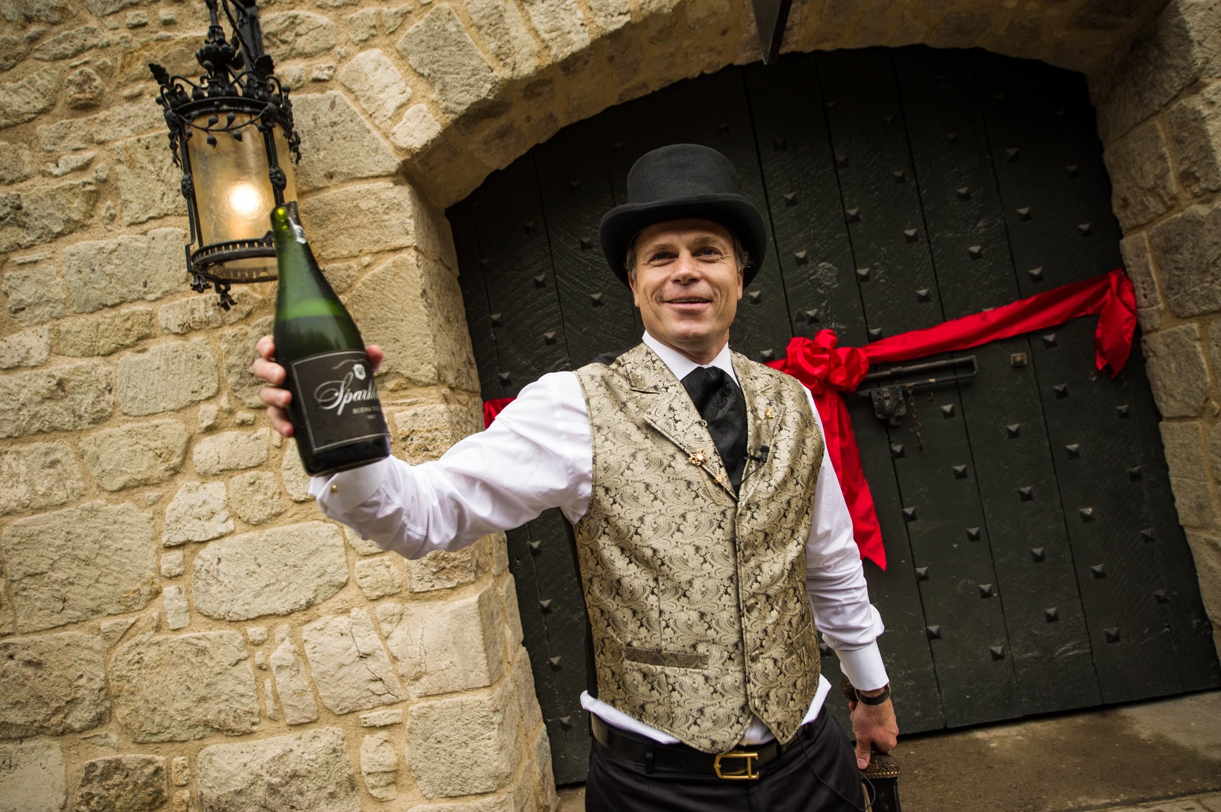 Jean-Charles Boisset at Buena Vista Winery, presenting a bottle at the historic stone press house